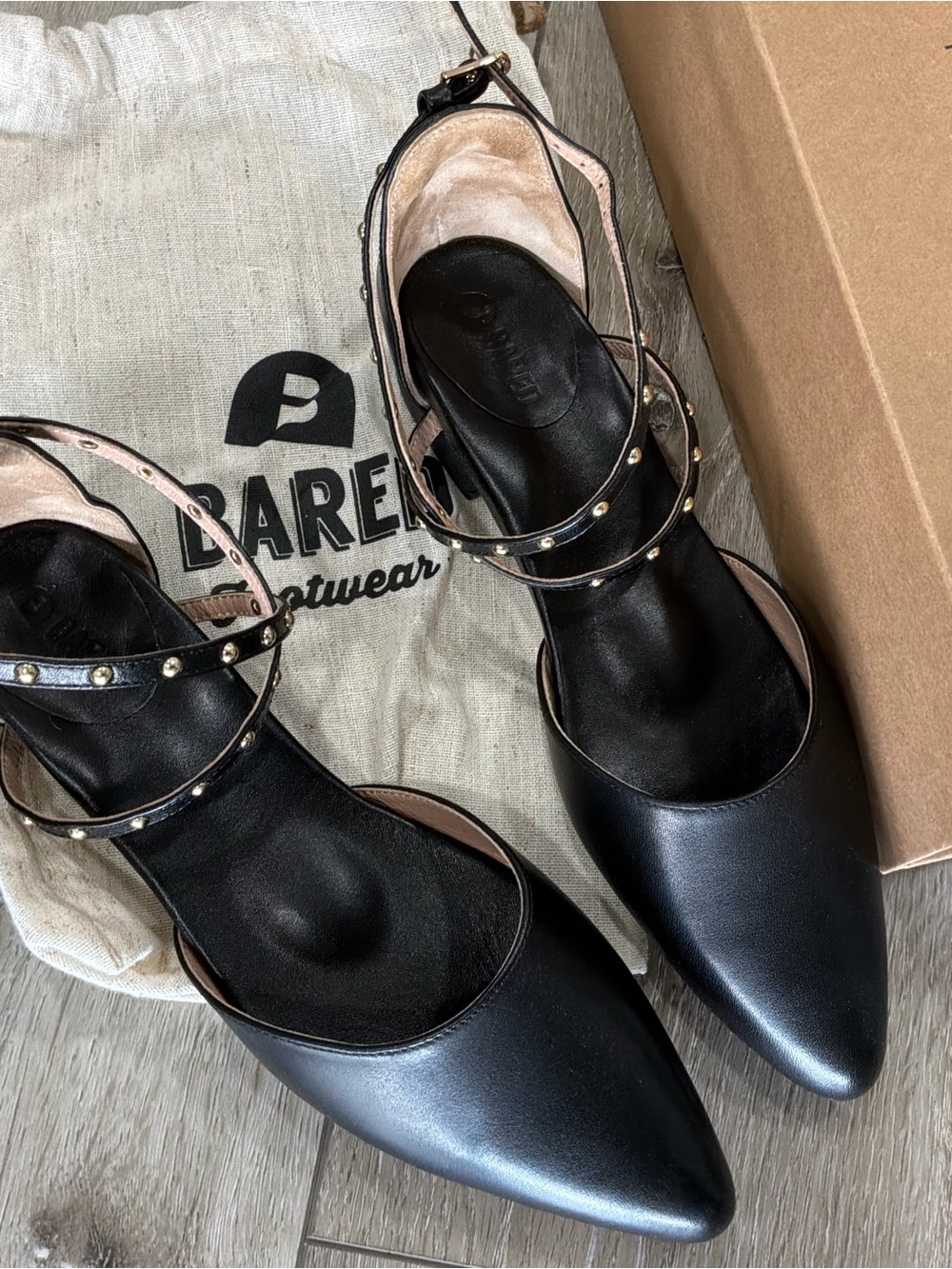 Bared Black Pointed Leather Studded Ankle-Strap Flats with Gold Accents